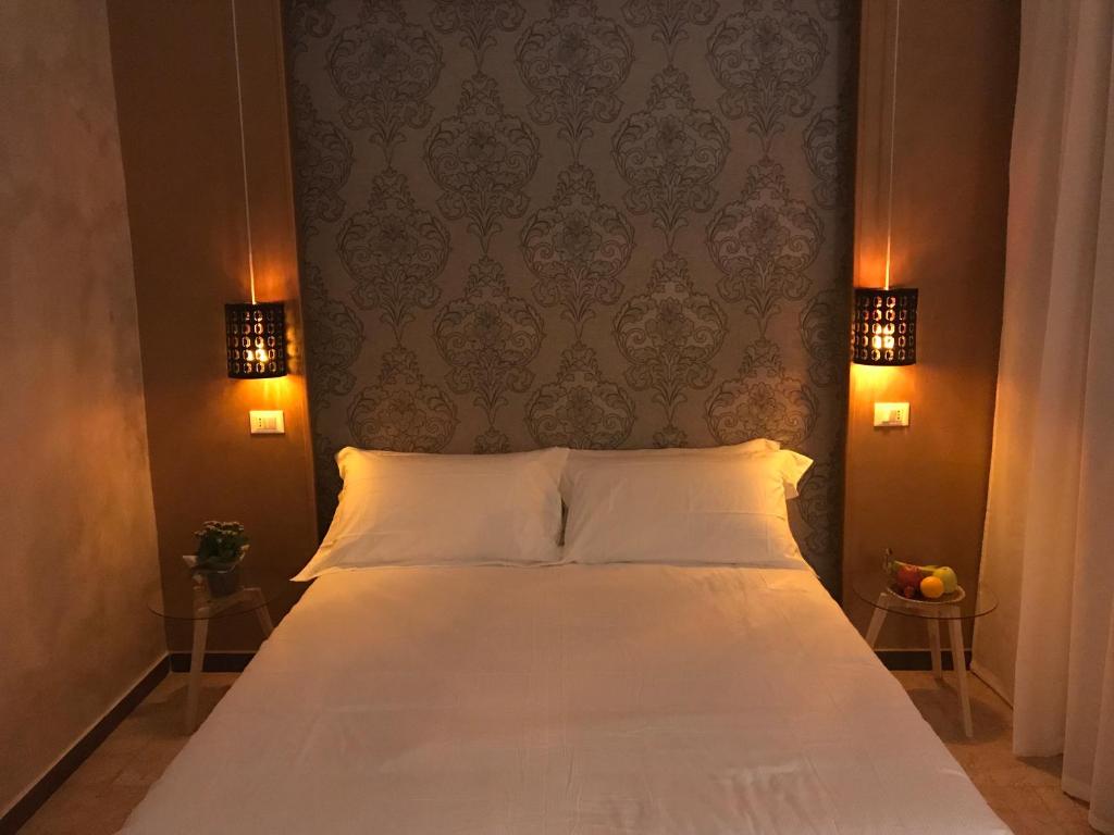 Posteľ alebo postele v izbe v ubytovaní Hotel Raphael