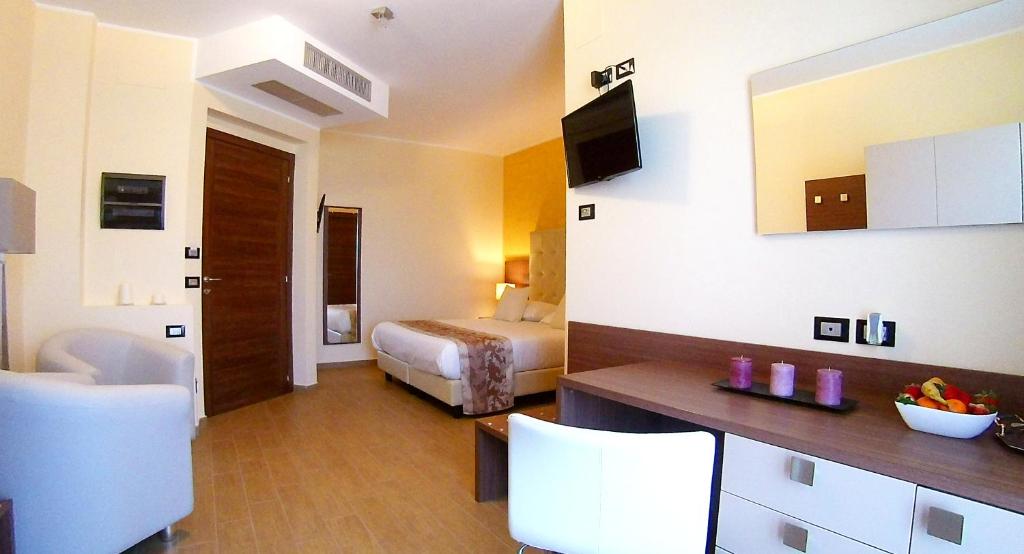 TV a/nebo společenská místnost v ubytování Hotel Residence Eden