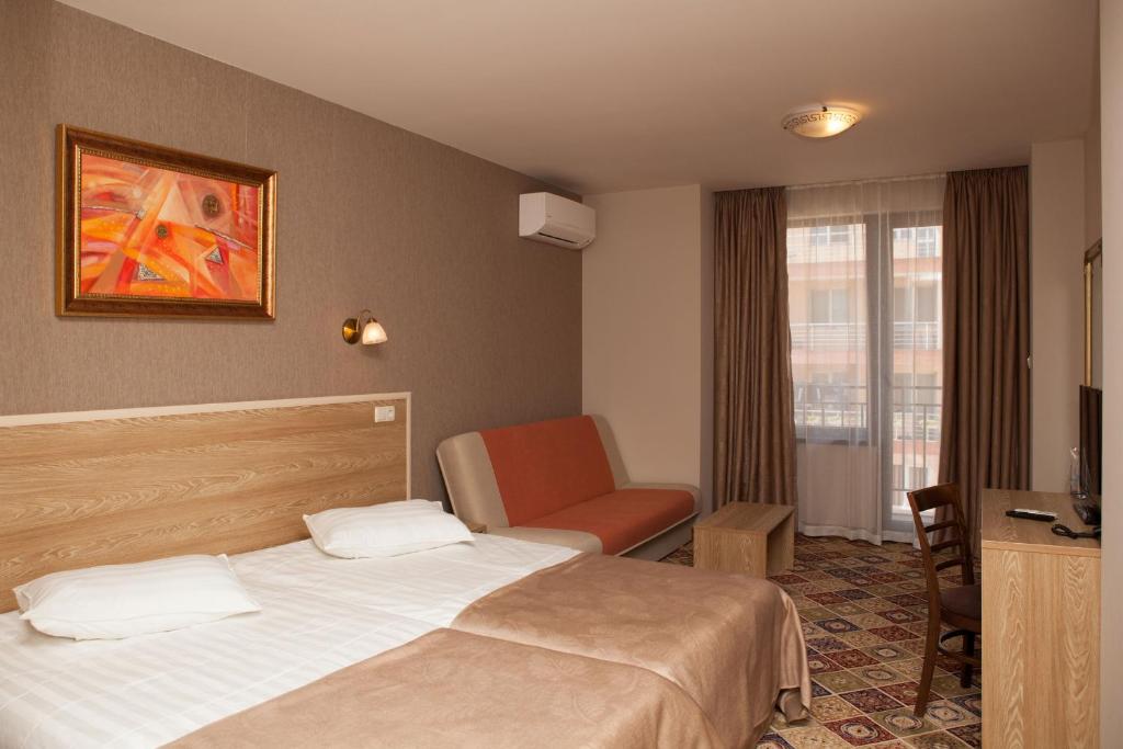 Postel nebo postele na pokoji v ubytování Hotel Motto