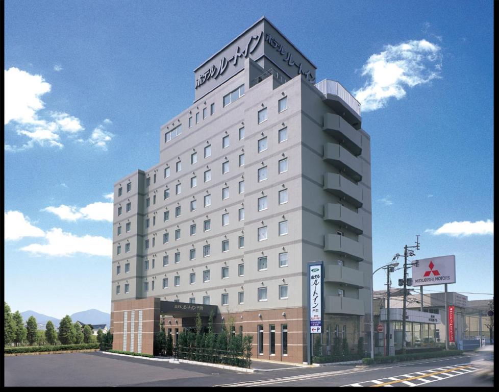 a rendering of a hotel building on a street at Hotel Route-Inn Mojiko in Kitakyushu