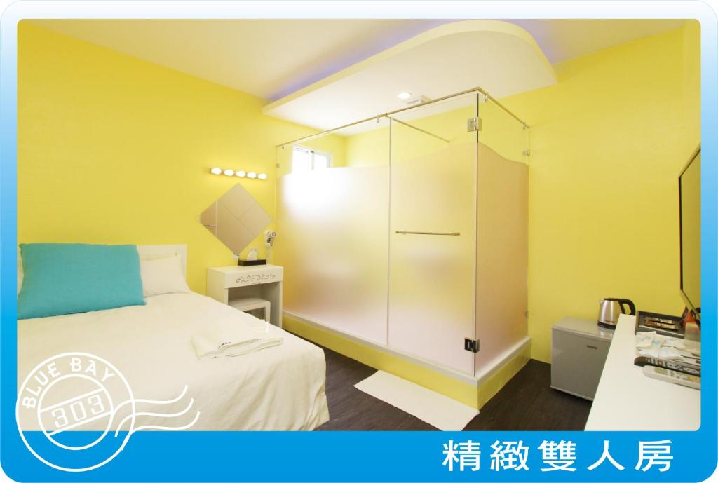 Postel nebo postele na pokoji v ubytování Kenting Blue Bay Inn