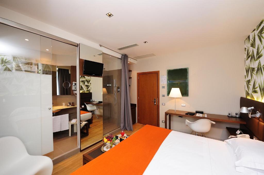 Cama ou camas em um quarto em Dal Moro Gallery Hotel