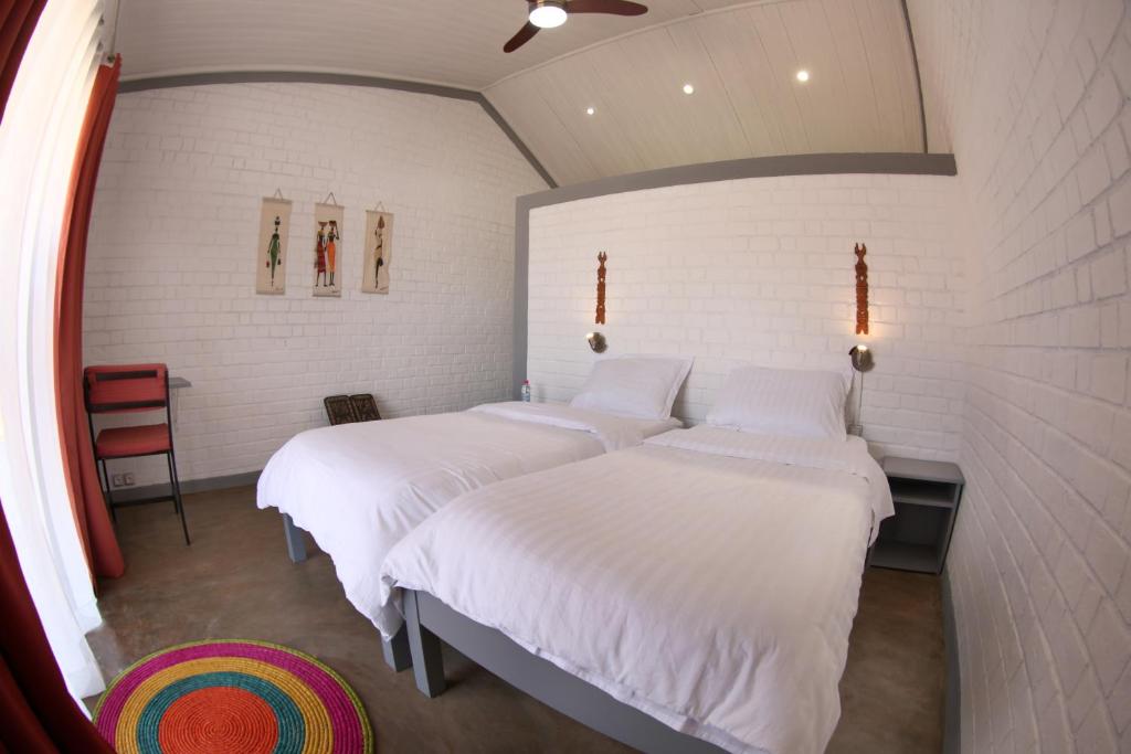 En eller flere senger på et rom på Le Chat'o Park Hotel Ivato Airport NAVETTE GRATUITE H24