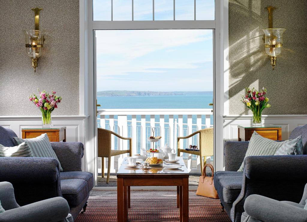 a living room with a view of the ocean at Dunmore House Hotel in Clonakilty