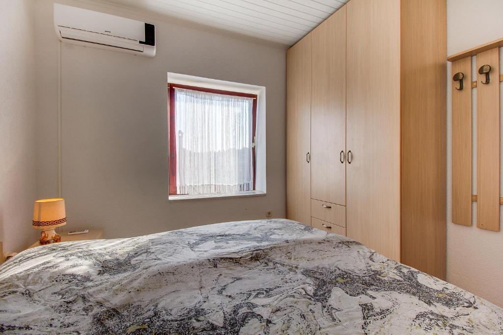 Posteľ alebo postele v izbe v ubytovaní Apartman Haraciceva