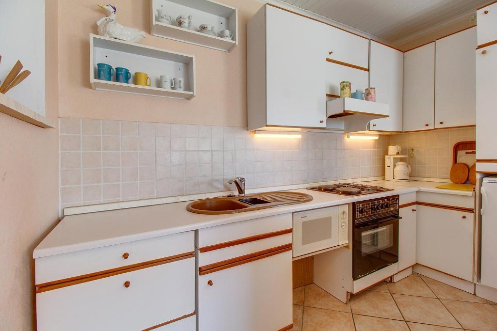 Kuchyňa alebo kuchynka v ubytovaní Apartman Haraciceva