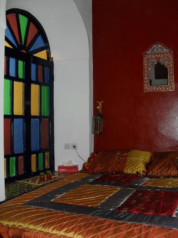Postel nebo postele na pokoji v ubytování Riad Tiziri
