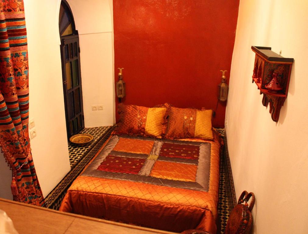 Postel nebo postele na pokoji v ubytování Riad Tiziri