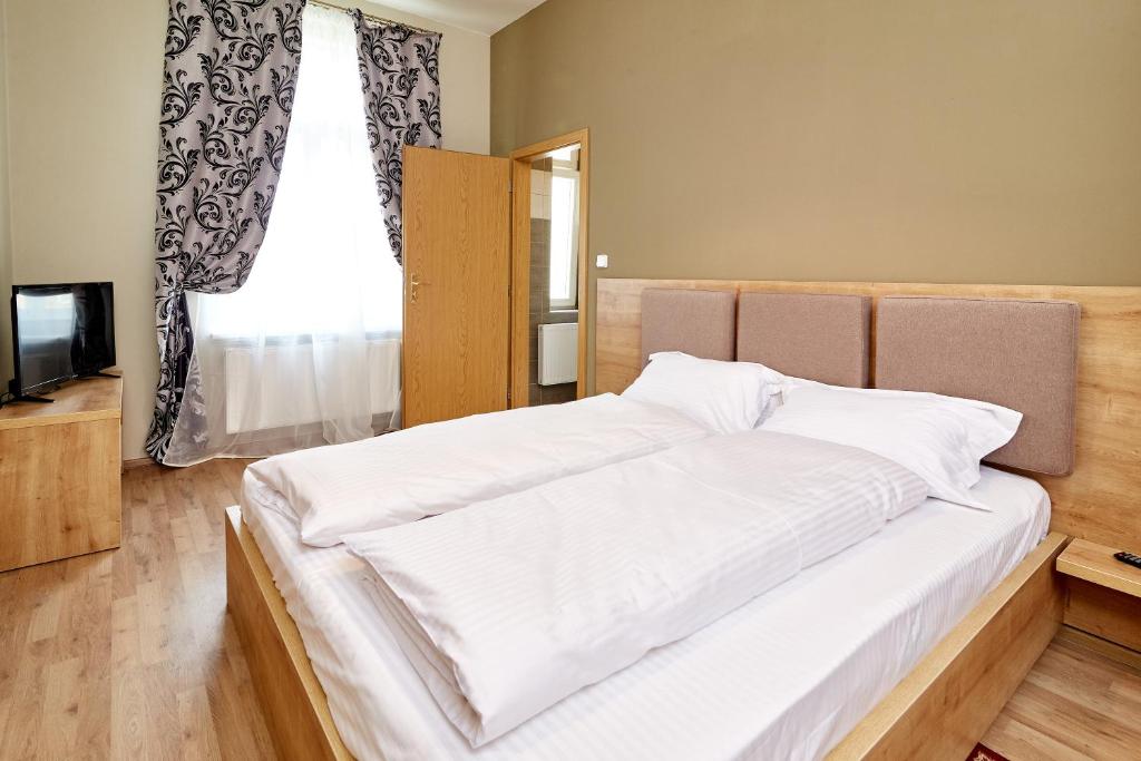 Postel nebo postele na pokoji v ubytování Kasablanka apartments