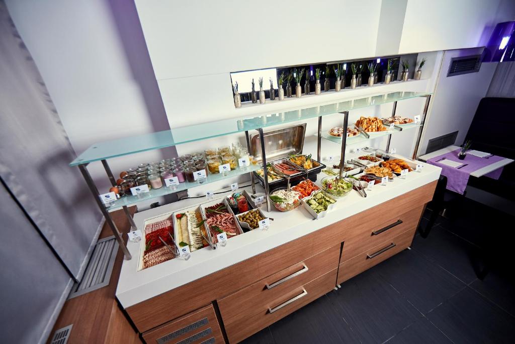 an overhead view of a buffet with food and drinks at Hotel Srbija Garden-FREE PARKING in Belgrade