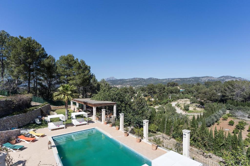 an aerial view of a house with a swimming pool at Majestic Holiday Estate in Calvia in Calvià