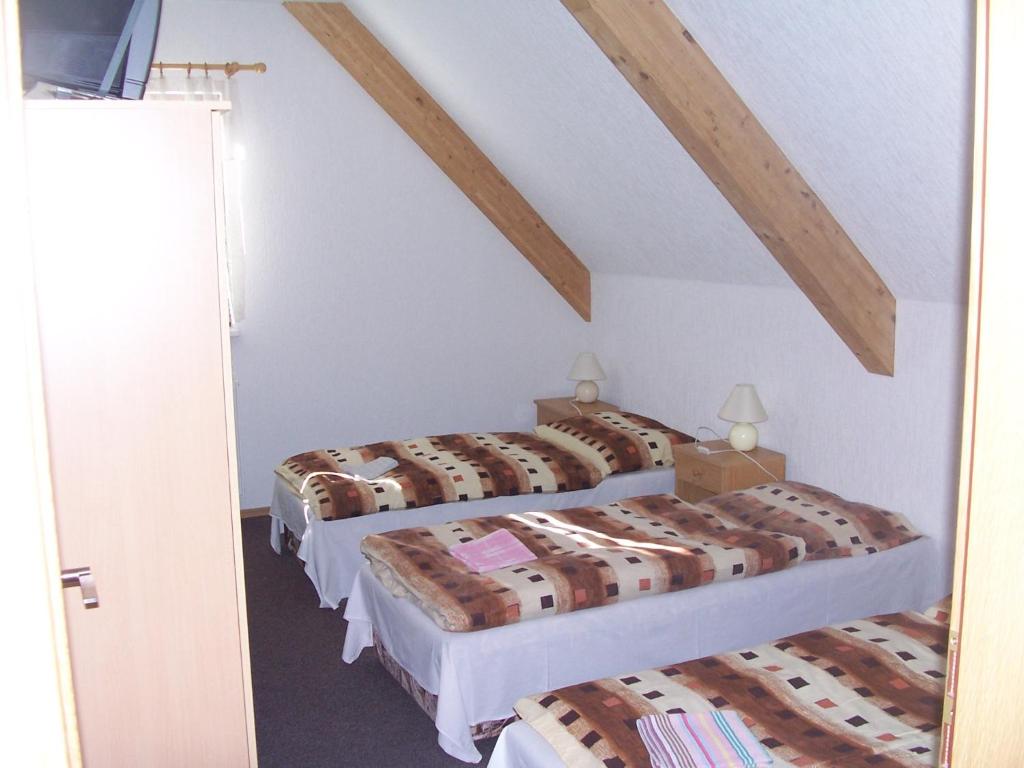 Postel nebo postele na pokoji v ubytování Penzion Chanos
