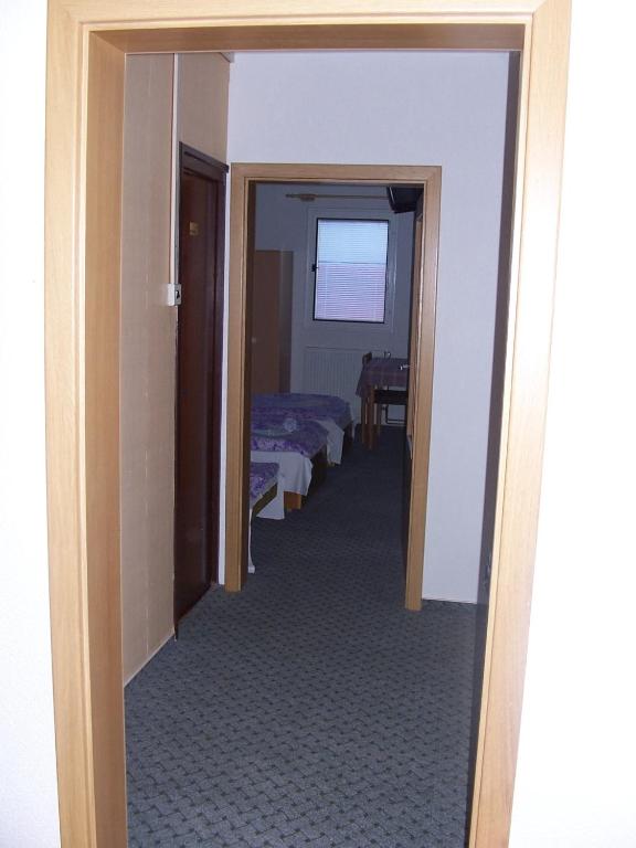 Postel nebo postele na pokoji v ubytování Penzion Chanos