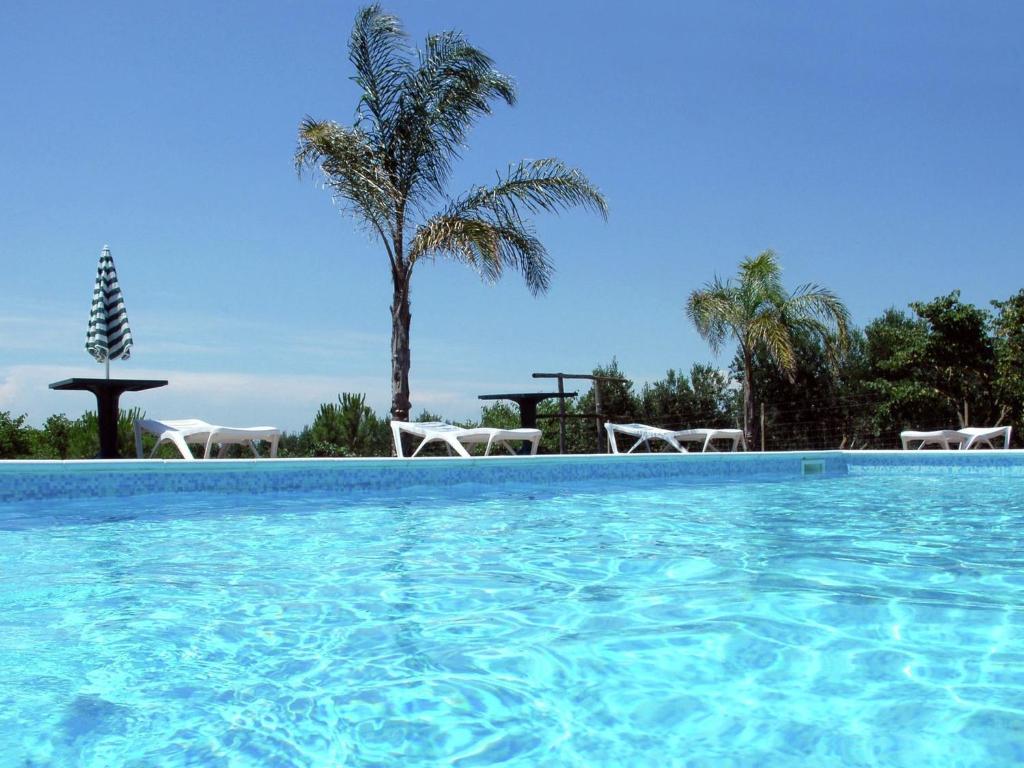 The swimming pool at or close to Belvilla by OYO Vento di Salento piccolo