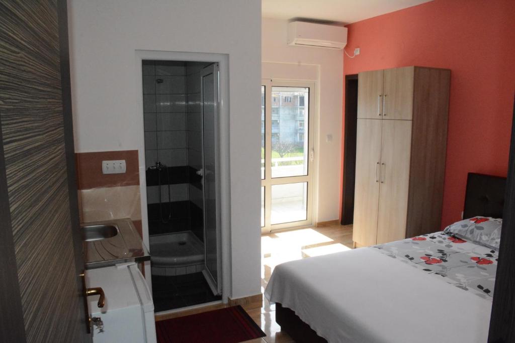 Voodi või voodid majutusasutuse Apartments Flamida toas