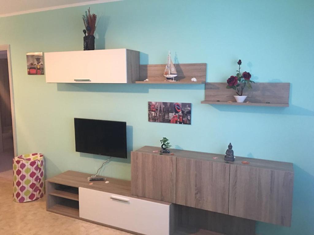 TV a/nebo společenská místnost v ubytování Phenix Home