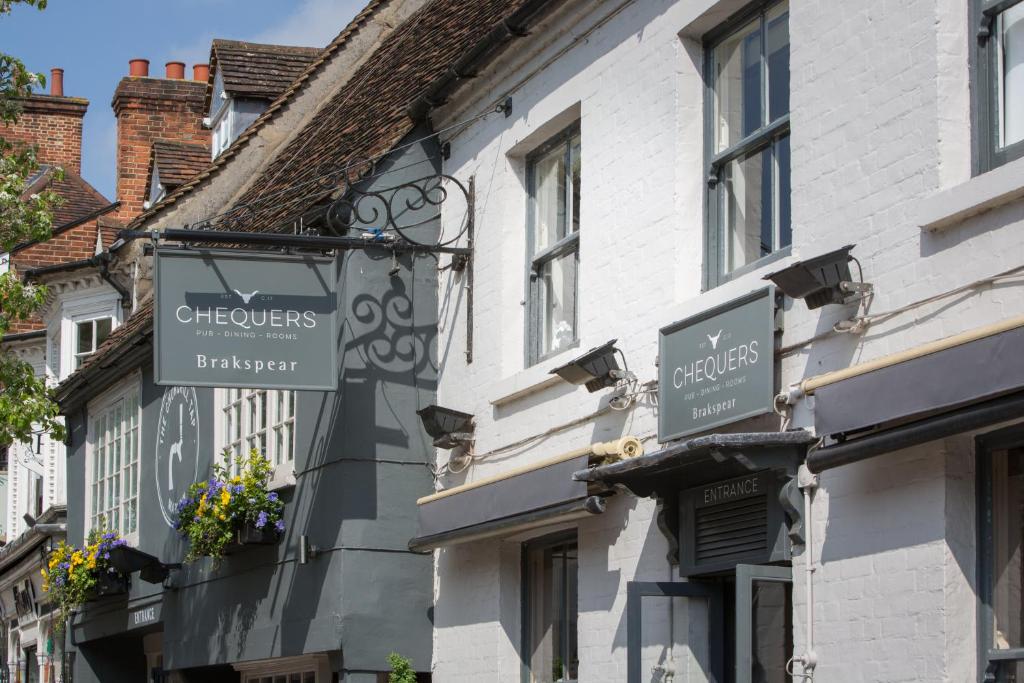 a building with signs on the side of it at The Chequers Marlow in Marlow