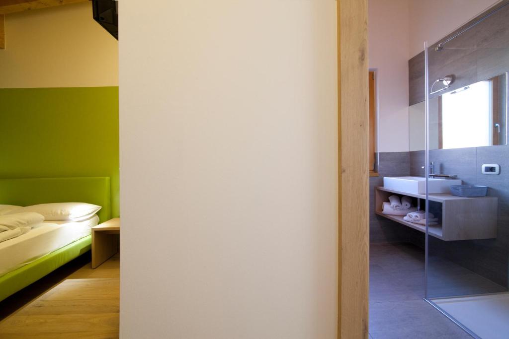 Voodi või voodid majutusasutuse Agritur I Colori toas