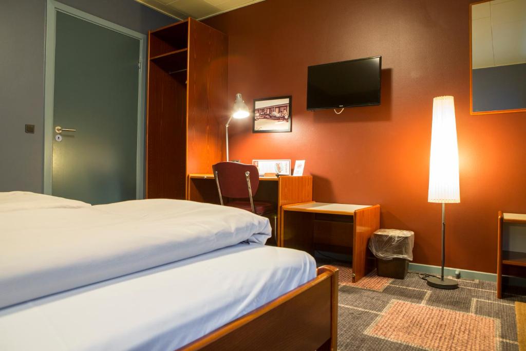 Postel nebo postele na pokoji v ubytování Wittrup Motel