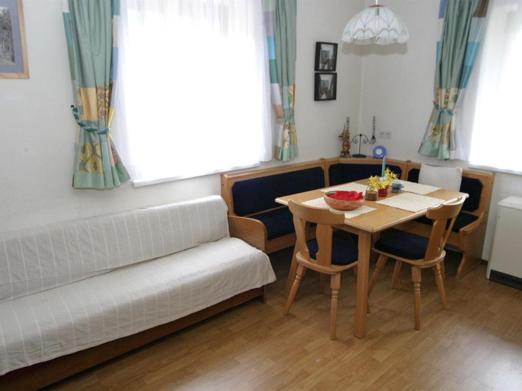 a living room with a couch and a table at Holiday home in Deutsch Griffen near Woerthersee in Deutschgriffen