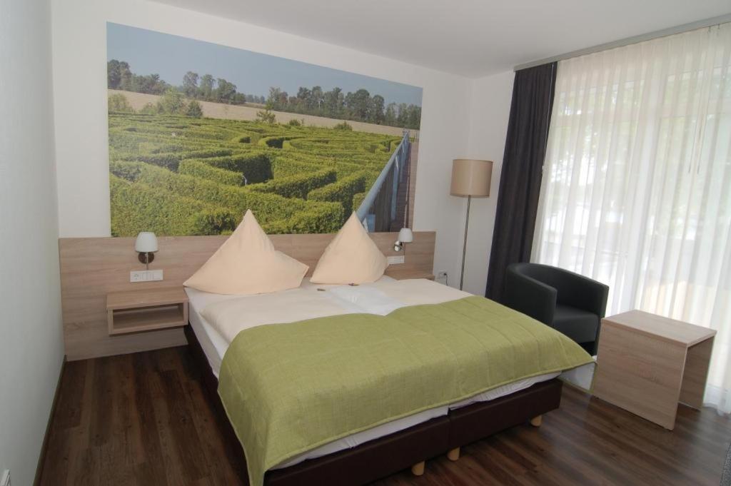 Postel nebo postele na pokoji v ubytování Ringhotel Alfsee Piazza