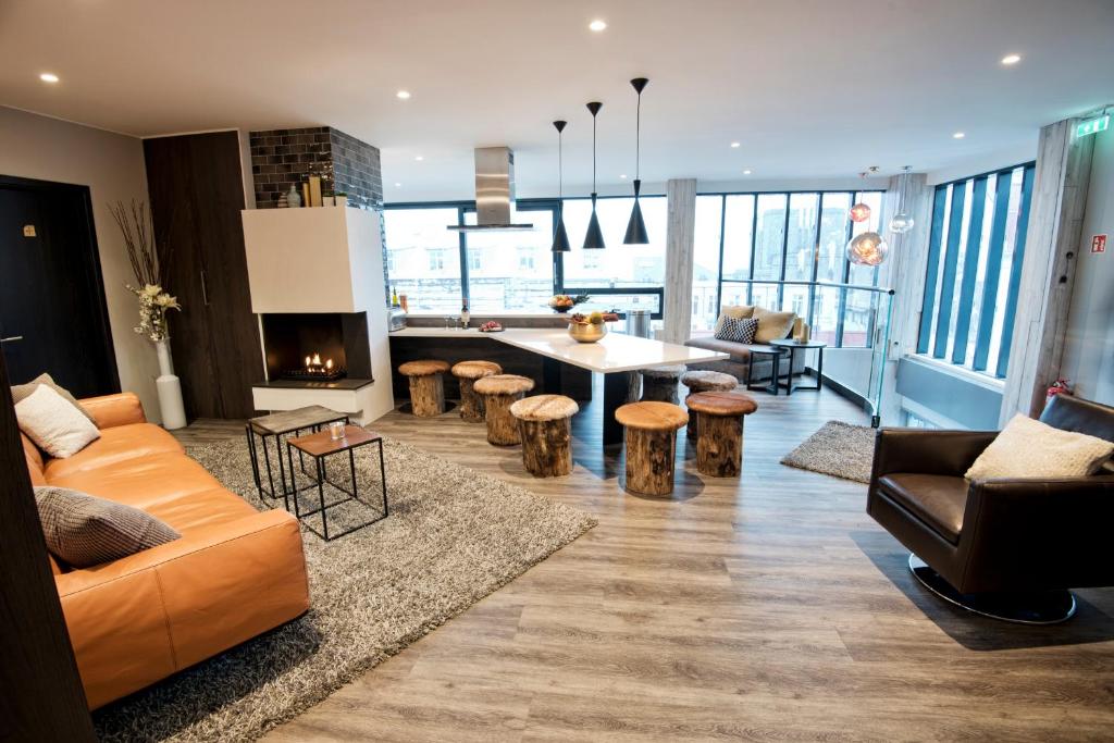 a living room with a couch and a table at B14 Apartments & Rooms in Reykjavík