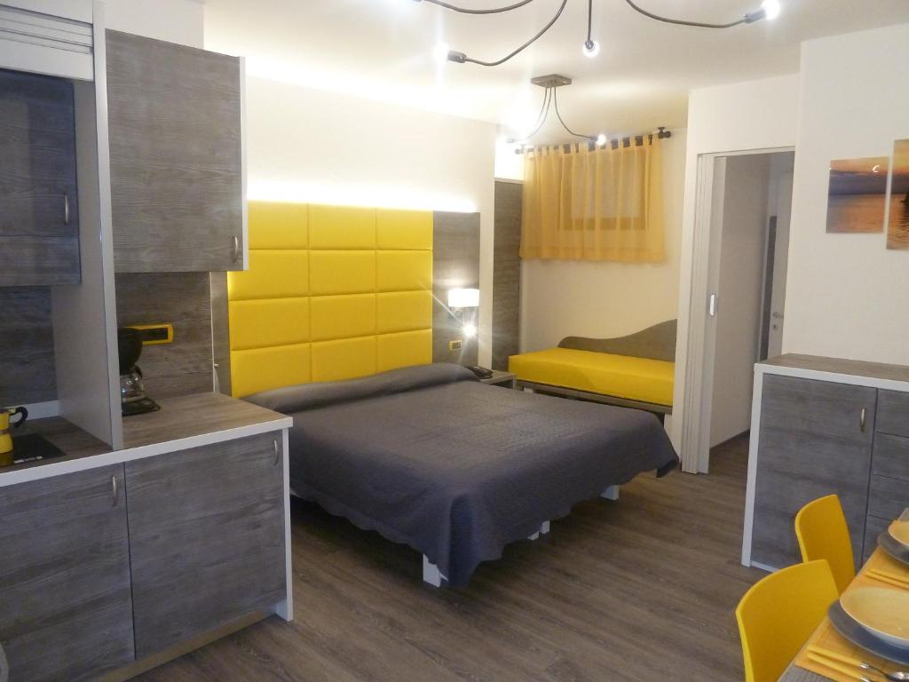 Postel nebo postele na pokoji v ubytování Albergo Casa Este