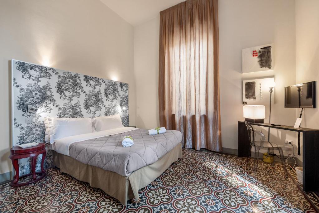 Llit o llits en una habitació de Lucca in Villa Lucrezia