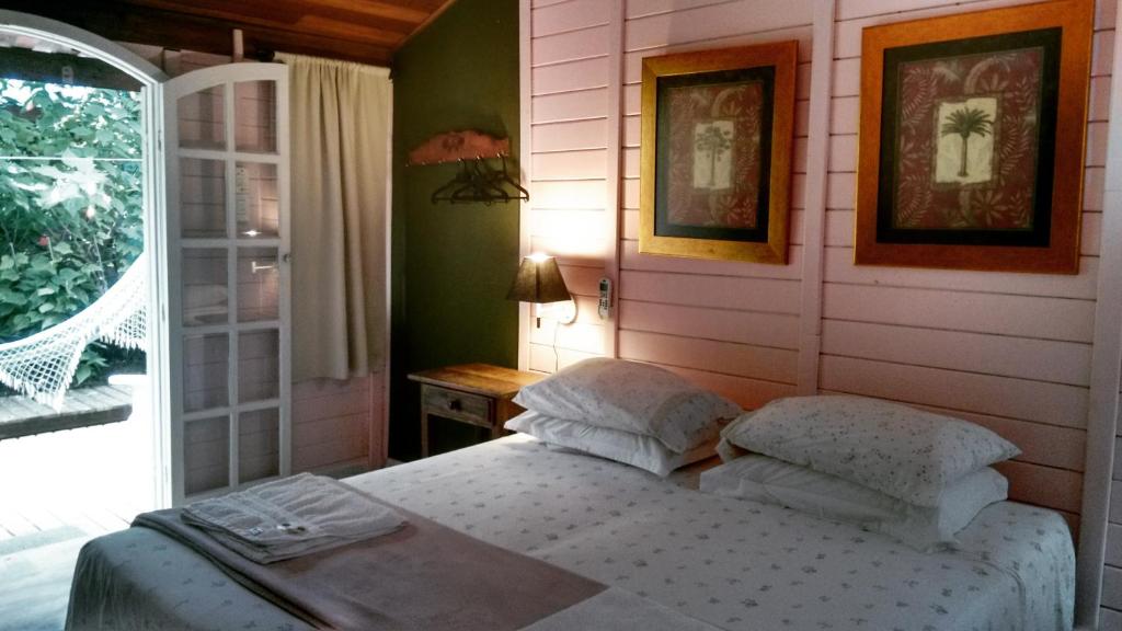 Ένα ή περισσότερα κρεβάτια σε δωμάτιο στο Pousada das Gêmeas