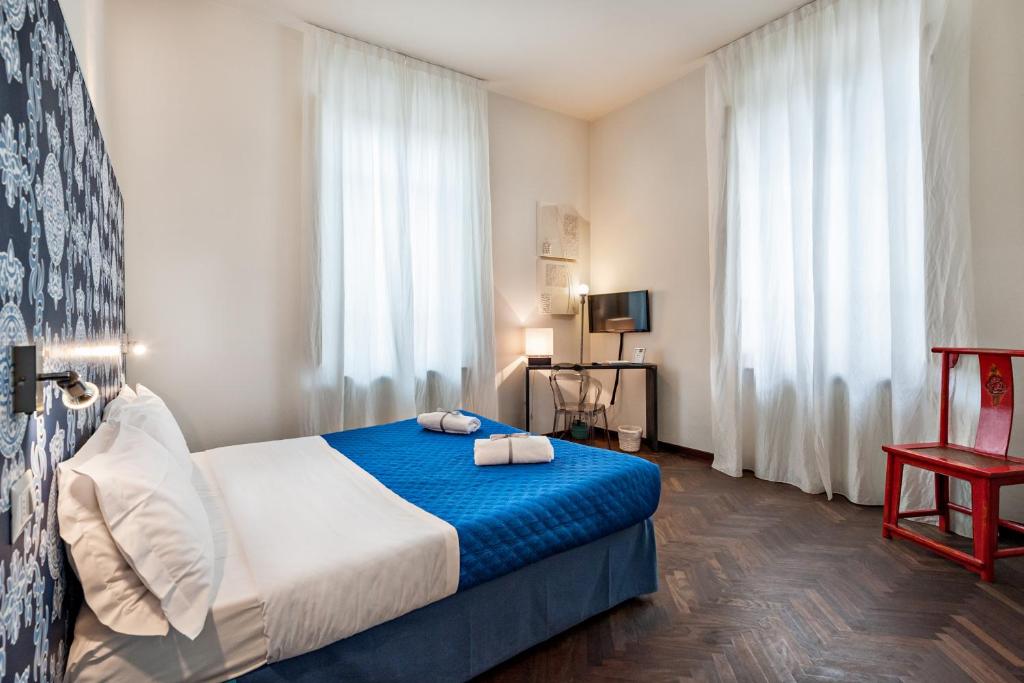 Llit o llits en una habitació de Lucca in Villa Lucrezia