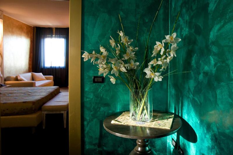 Postel nebo postele na pokoji v ubytování Hotel Bella 'Mbriana