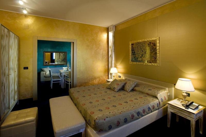 Postel nebo postele na pokoji v ubytování Hotel Bella 'Mbriana
