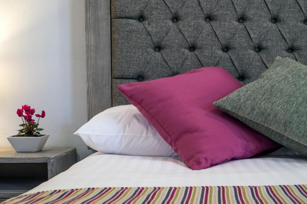 Postel nebo postele na pokoji v ubytování Hotel Casa Aurora