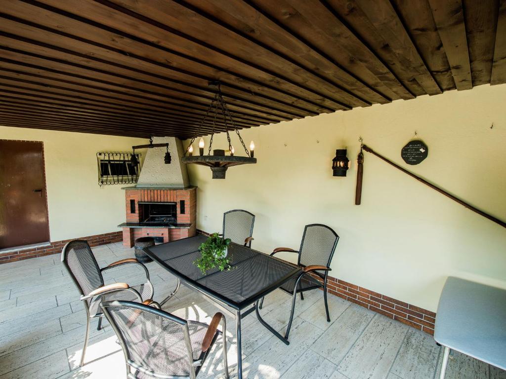 a dining room with a table and chairs at Apartment near the forest in Plankenstein in Plankenfels