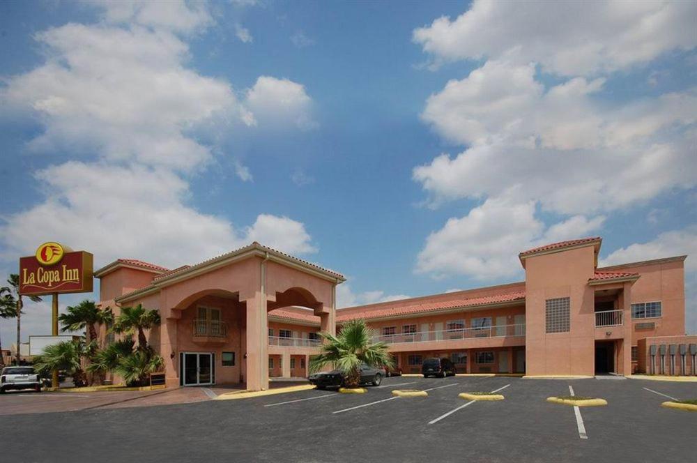 an empty parking lot in front of a hotel at La Copa Inn in McAllen