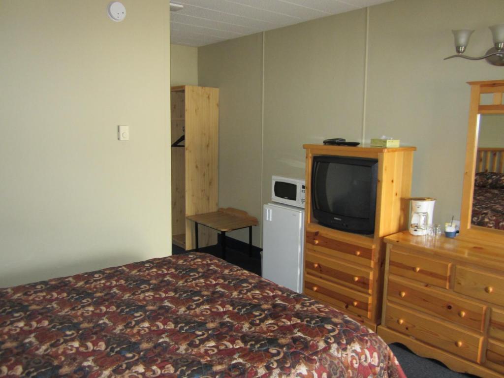 Postel nebo postele na pokoji v ubytování Schell Motel
