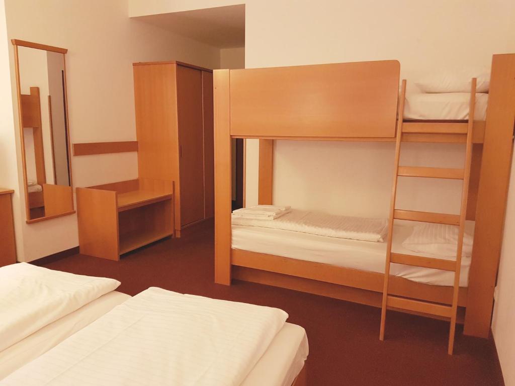 Postel nebo postele na pokoji v ubytování Hotel Haydn