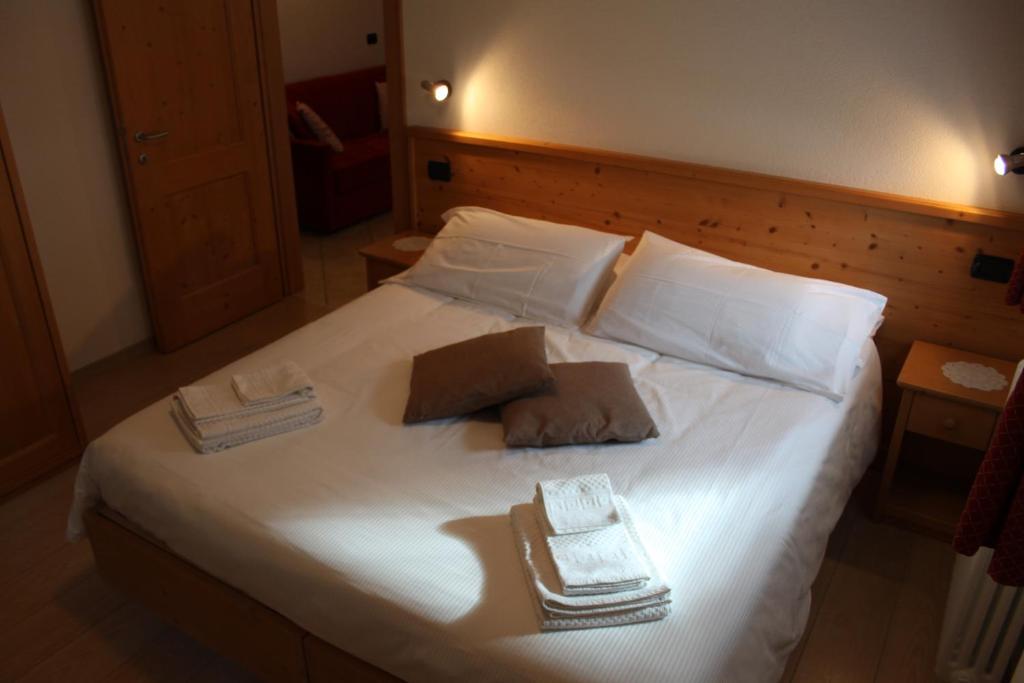 Postel nebo postele na pokoji v ubytování Chalet Del Bosco