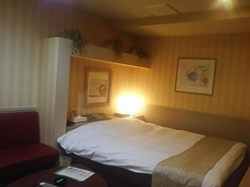 Postel nebo postele na pokoji v ubytování Hotel Sting