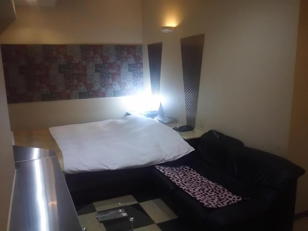 Postel nebo postele na pokoji v ubytování Hotel Sting