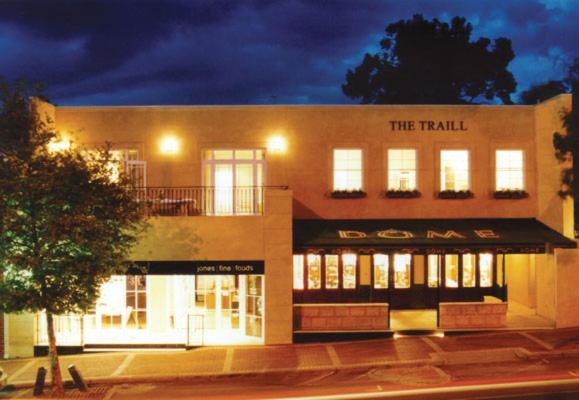 a tall building with lights on in a street at The Traill in Margaret River Town