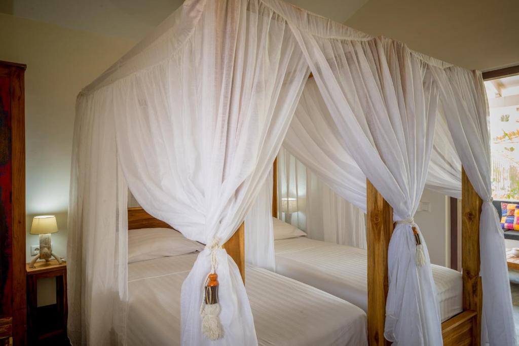 Postel nebo postele na pokoji v ubytování Windhoek Resort Bonaire