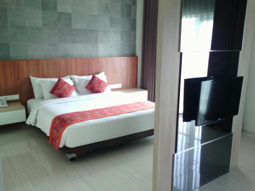 Postel nebo postele na pokoji v ubytování Moscato Hotel