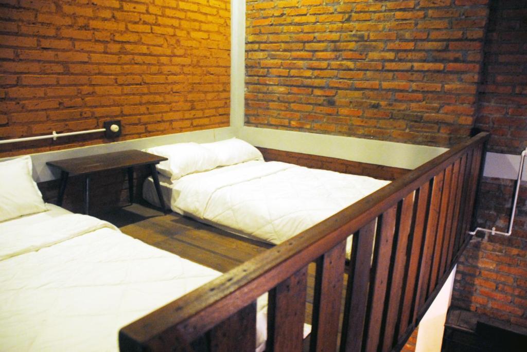 Postel nebo postele na pokoji v ubytování Griya Gribig Guest House Mitra RedDoorz