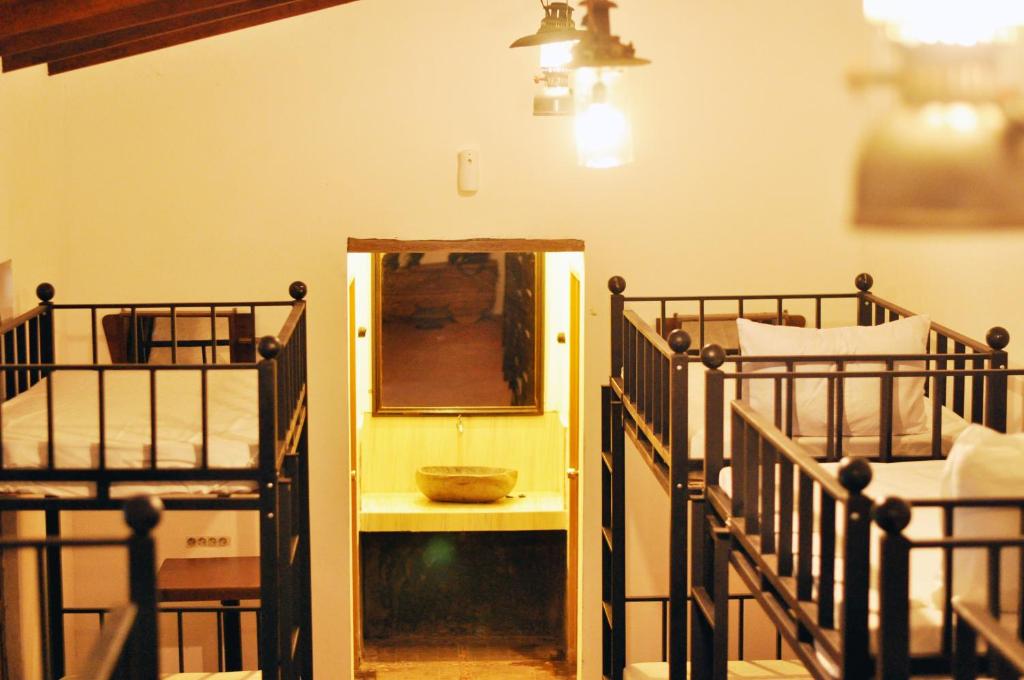 Postel nebo postele na pokoji v ubytování Griya Gribig Guest House Mitra RedDoorz