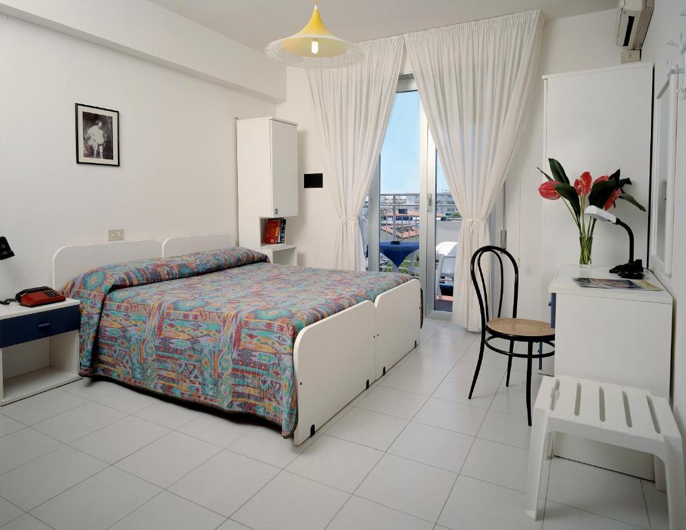 Posteľ alebo postele v izbe v ubytovaní Hotel Wally