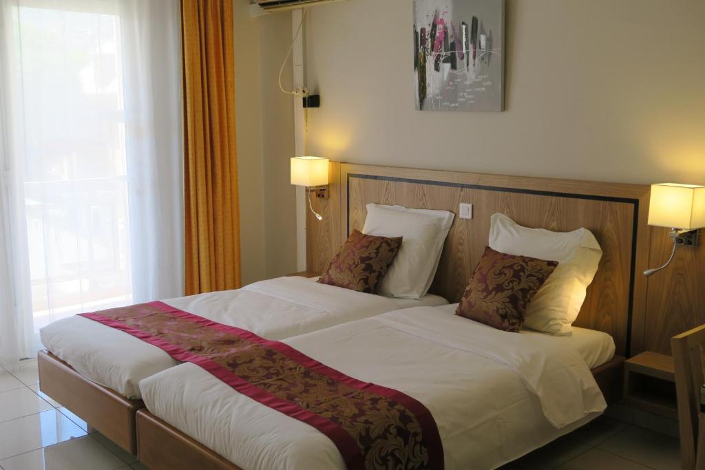 Postel nebo postele na pokoji v ubytování Central Hotel
