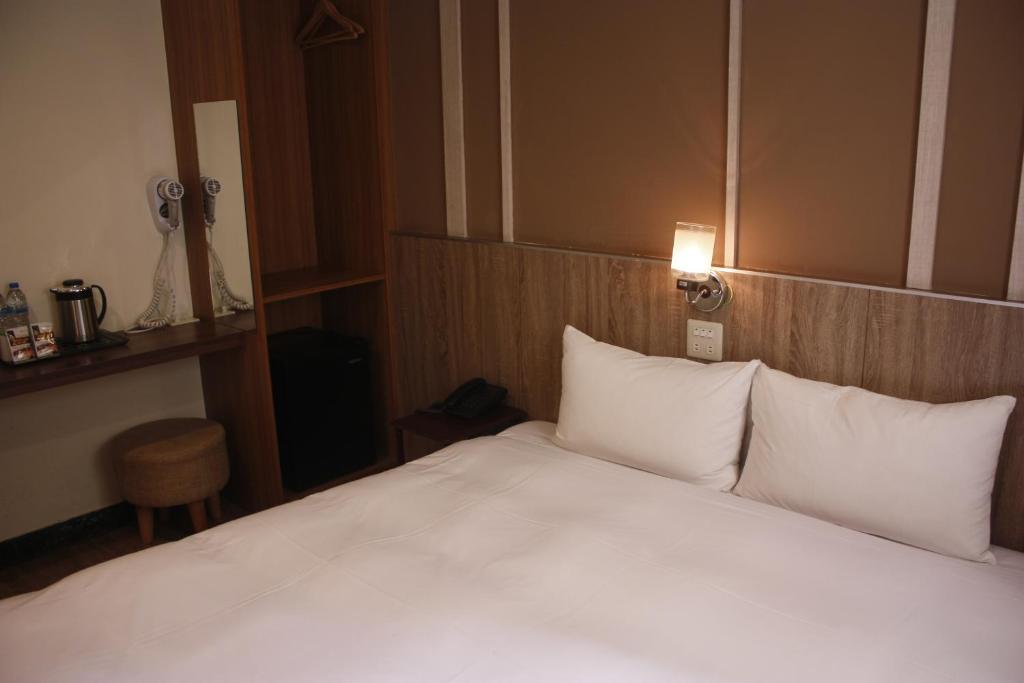 Postel nebo postele na pokoji v ubytování Prince Hotel