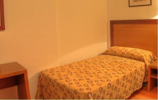 Postel nebo postele na pokoji v ubytování Hotel Torrezaf