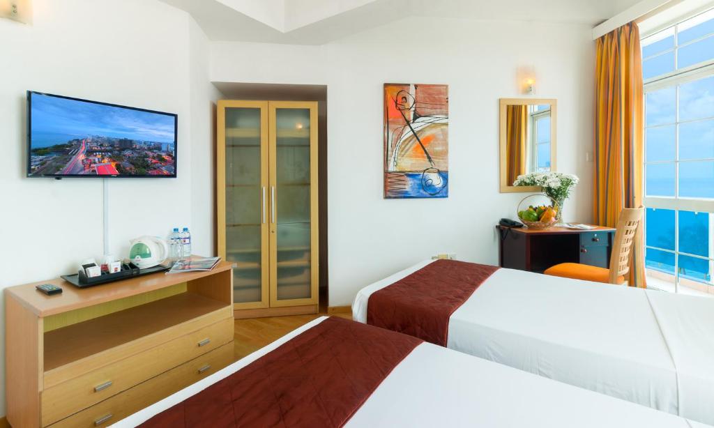Postel nebo postele na pokoji v ubytování Global Towers Hotel & Apartments